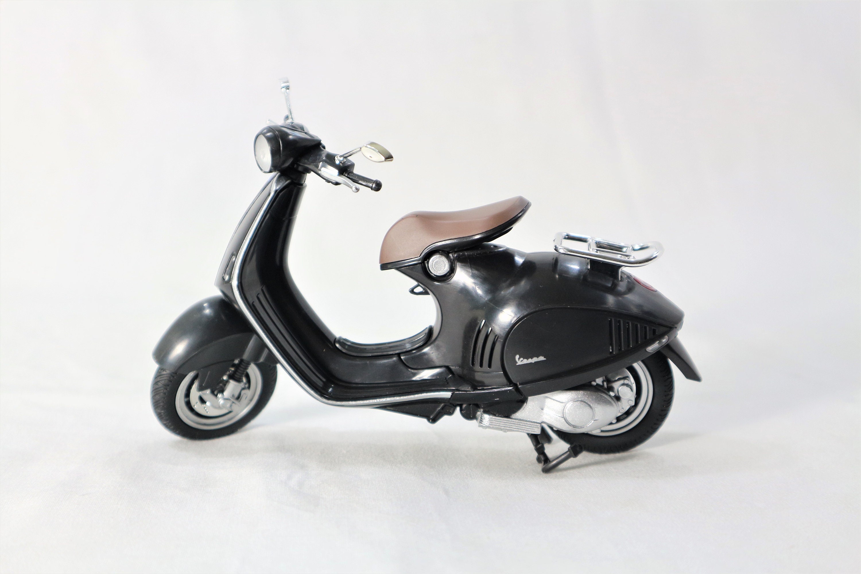 Craftsman styling miniature vespa after painting in home-based