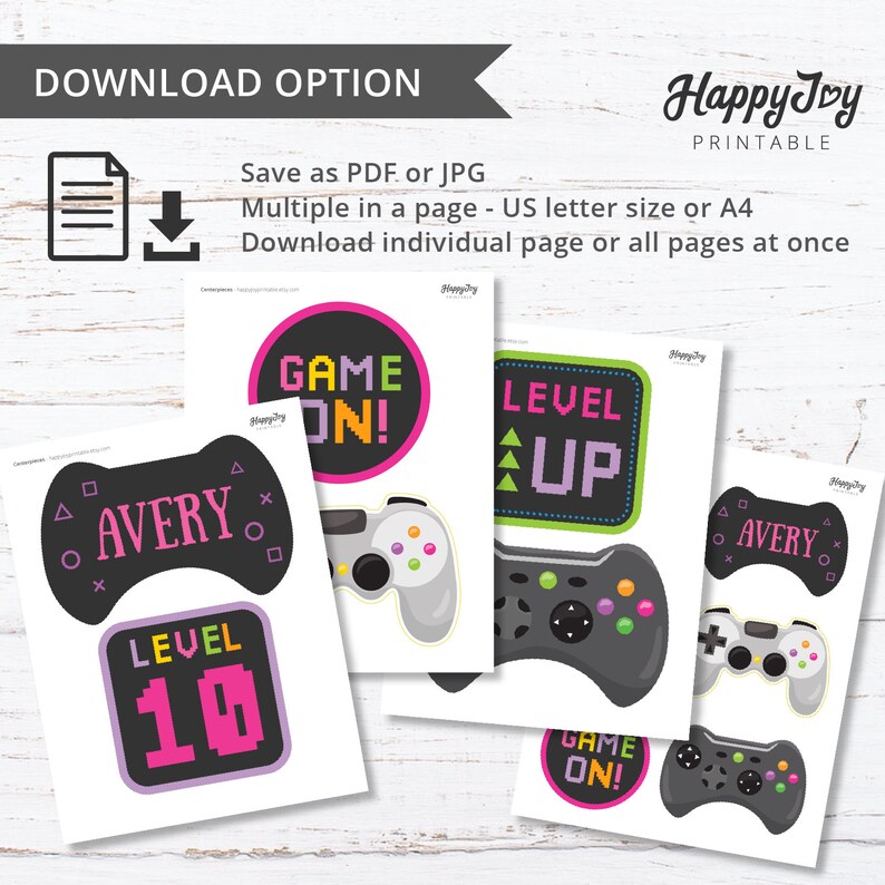 May include: Printable party decorations for a video game themed party. The decorations feature a black and white gamepad with pink and green accents, and text that says "Game On!" and "Level Up".