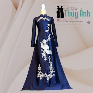 Woman Vietnamese Áo Dài –  white embroidery of a phoenix and blossoms with White or Navy Blue Pants