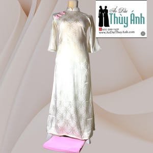 Cream Cach Tan Ao Dai Dang Suong Tay Loe Vietnamese Long Dress Flared Sleeves with pink   Pants