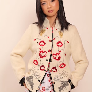 White wool jacket with floral embroidery and natural silk lining