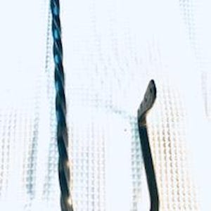 May include: Black metal hook with a twisted design. The hook is curved at the end and has a flat base.