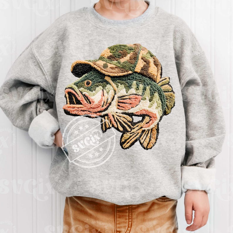 May include: A grey sweatshirt with an embroidered design of a largemouth bass wearing a camouflage hat. The fish has green, brown, and orange details. The sweatshirt has a crew neck and long sleeves with white cuffs.