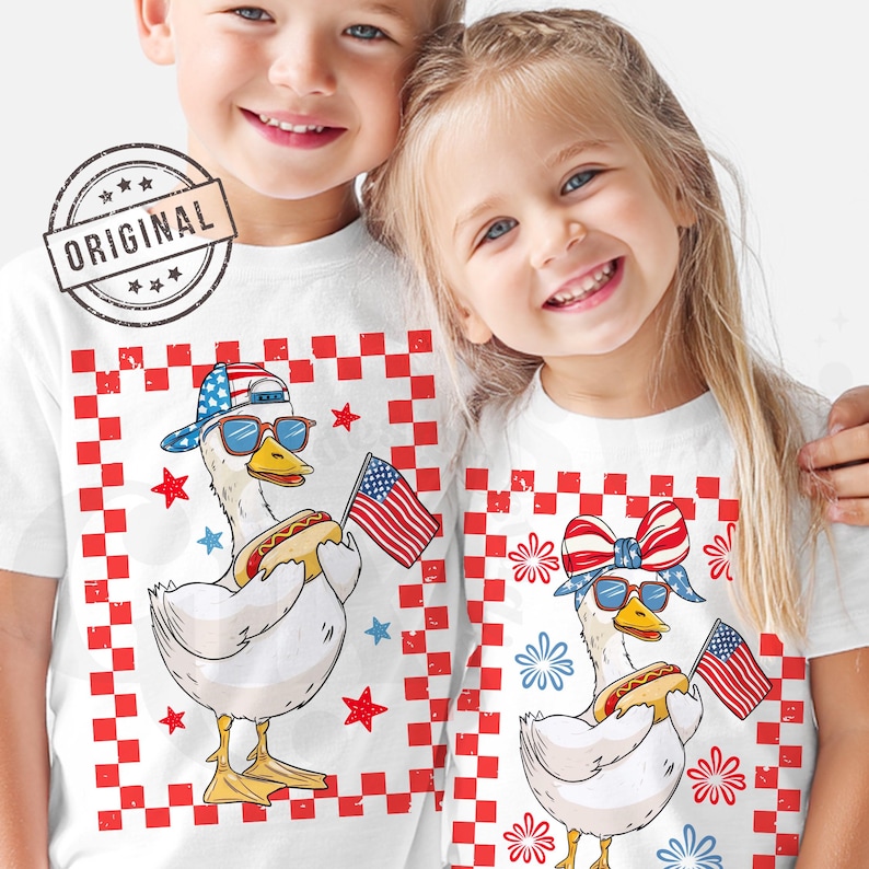 May include: Two white t-shirts with a red, white, and blue checkered background. Each shirt features a cartoon duck wearing sunglasses, a red, white, and blue bandana, and holding a hot dog. One duck is wearing a baseball cap and the other is wearing a red, white, and blue bow.