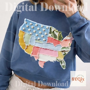 May include: A blue sweatshirt featuring a patchwork design of the United States map. The map incorporates various fabric patterns, including a blue section with white stars representing the flag. The sweatshirt has a cropped fit and long sleeves.
