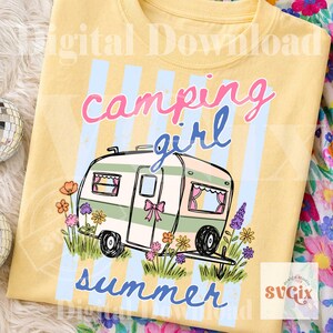 May include: Yellow t-shirt featuring a green and white campervan illustration, surrounded by flowers, and the words "camping girl summer" in pink and blue. The design has a vintage feel.