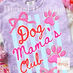 May include: A light purple t-shirt with the words "Dog Mama Club" in red and pink script. The shirt features light blue vertical stripes, pink paw prints, and pink bow graphics. The shirt is a Comfort Colors brand.