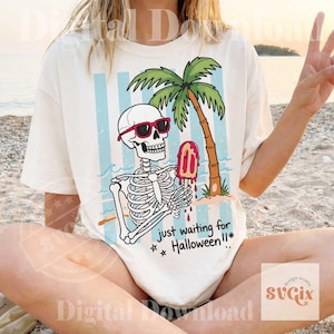 May include: Off-white t-shirt featuring a skeleton wearing red sunglasses, holding a popsicle, and sitting under a palm tree. The shirt has blue and white stripes in the background, with the text "just waiting for Halloween!!*".
