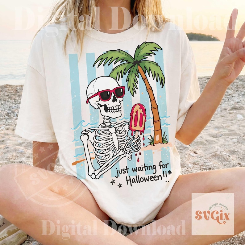 May include: Off-white t-shirt featuring a skeleton wearing red sunglasses, holding a popsicle, and sitting under a palm tree. The shirt has blue and white stripes in the background, with the text "just waiting for Halloween!!*".