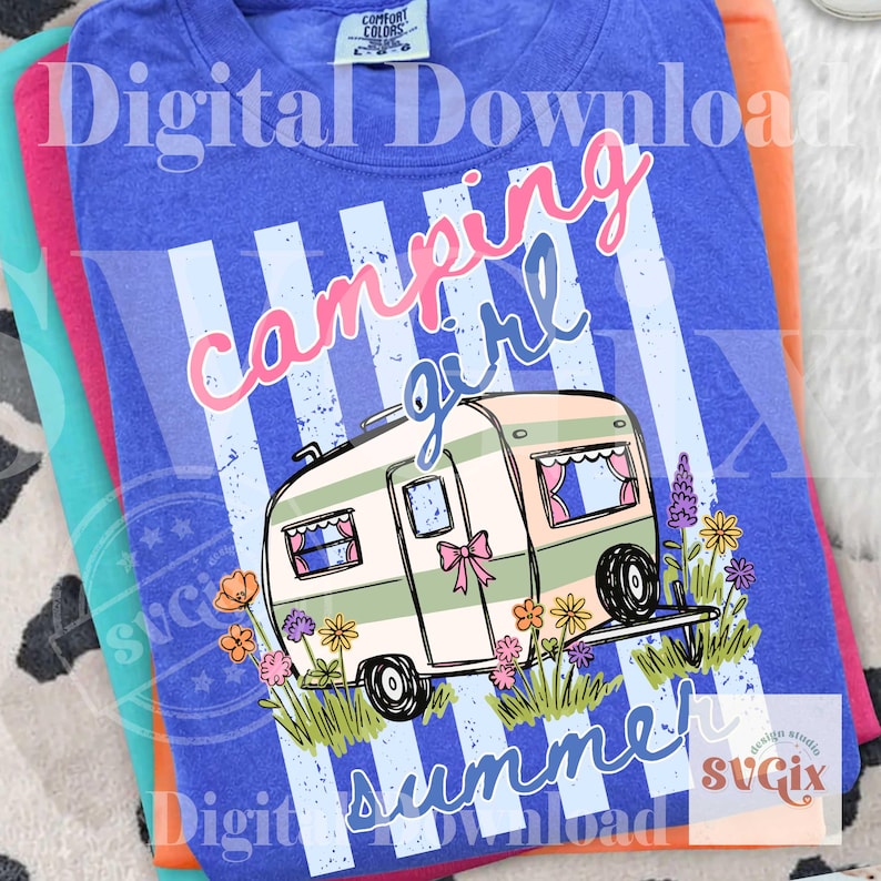May include: A blue t-shirt with a graphic design featuring a vintage camper, flowers, and the words "Camping Girl Summer." The design has a distressed look with vertical stripes and text in pink and blue.