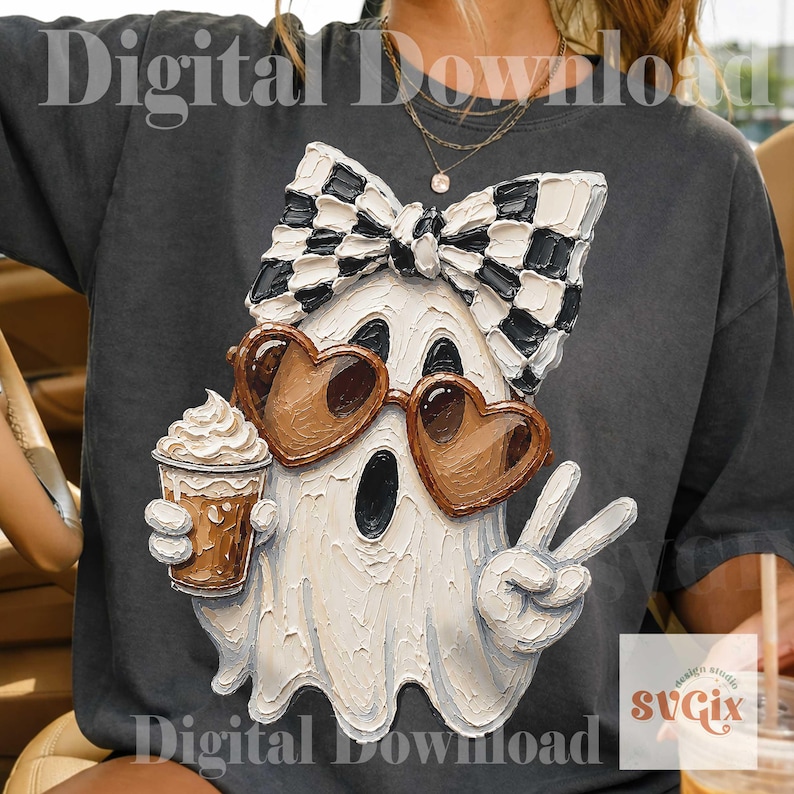 May include: A charcoal gray t-shirt featuring a textured, painterly graphic of a white ghost wearing a black and white checkered bow, brown heart-shaped sunglasses, and holding a coffee cup while making a peace sign with one hand.
