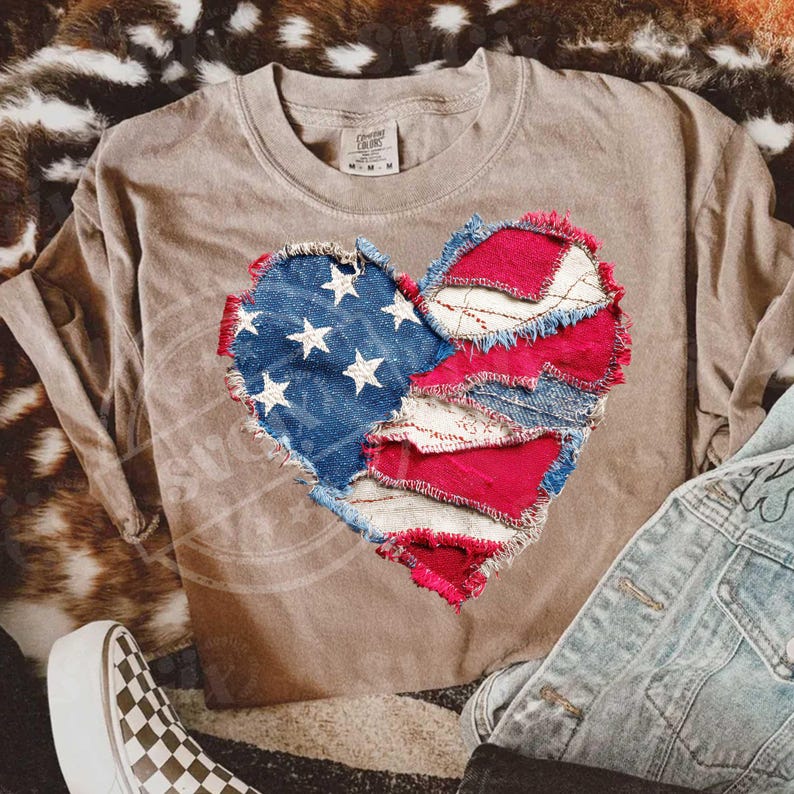 May include: A tan long-sleeved shirt with a heart design made from denim patches in the style of the American flag. The heart features blue denim with white stars and red and white striped denim patches. The shirt is paired with denim jeans and a checkered shoe.