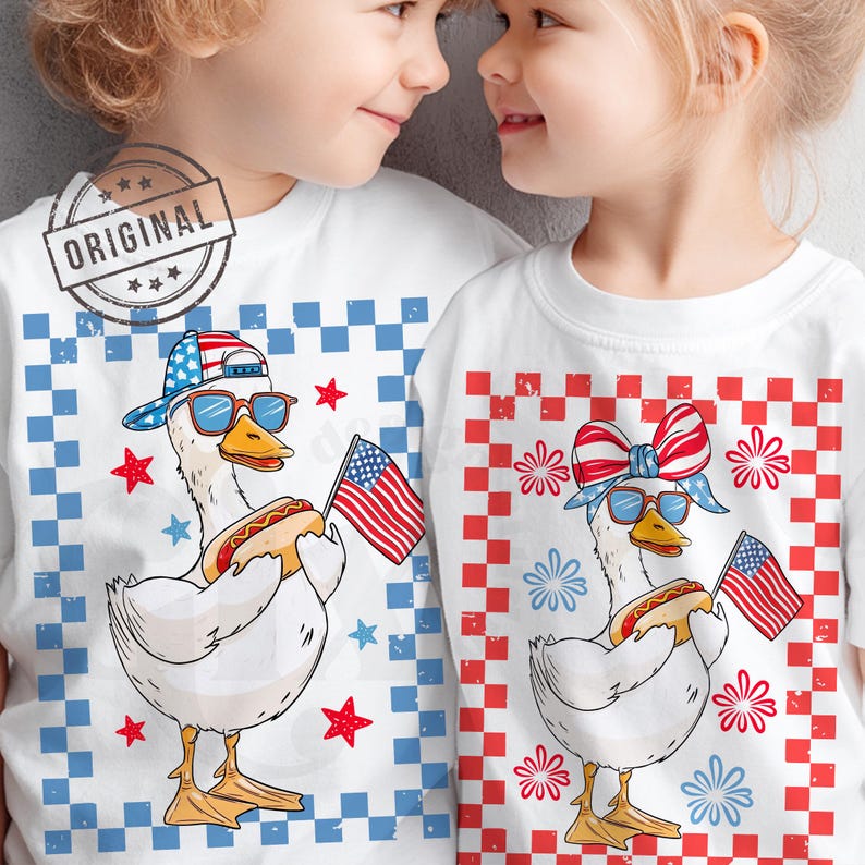 May include: Two children wearing white t-shirts with a red, white, and blue checkered pattern. The shirts feature a cartoon goose wearing sunglasses, a red, white, and blue bandana, and holding a hot dog. The goose is also holding a small American flag. The shirts are a fun and festive way to celebrate the 4th of July.