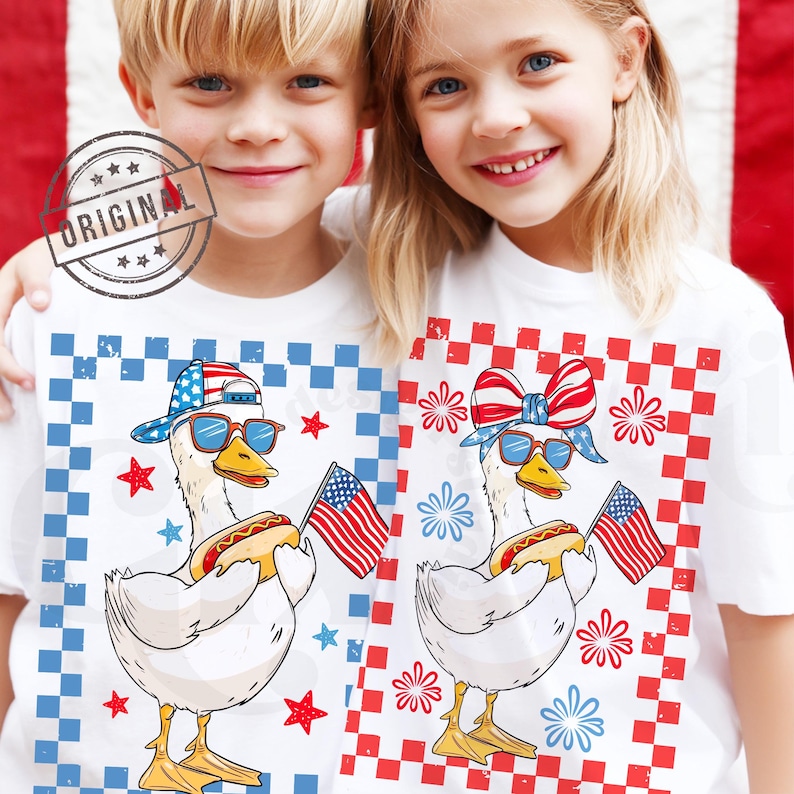 May include: Two children wearing white t-shirts with a red, white, and blue checkered background. The shirts feature a cartoon goose wearing sunglasses, a red, white, and blue bandana, and a red, white, and blue baseball cap. The goose is holding a hot dog and an American flag.