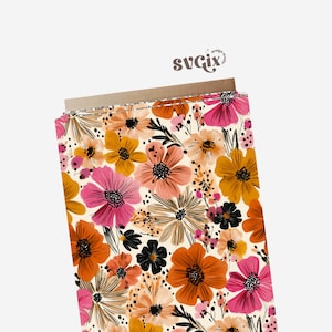 May include: A roll of fabric featuring a vibrant floral pattern. The design includes large, stylized flowers in shades of pink, orange, yellow, and black, set against a cream background. The text "svgix" is visible in the upper right corner.