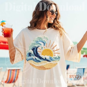 May include: Cream-colored t-shirt featuring an embroidered design of a wave, sun, and sand. The wave is depicted in shades of blue and green, the sun is yellow, and the sand is tan. The shirt has short sleeves and a relaxed fit. The text "Digital Download" is visible.