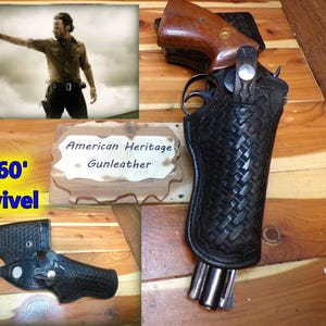 May include: A black leather gun holster with a woven pattern, holding a revolver with a wooden grip. The image includes a sign that reads "American Heritage Gunleather" and the words "360' Swivel". A photo of a man holding a gun is in the background.