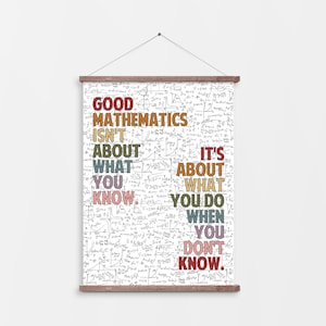 May include: A white poster with a wooden frame and a quote about mathematics. The text reads "Good Mathematics Isn't About What You Know. It's About What You Do When You Don't Know." The text is in various colors.