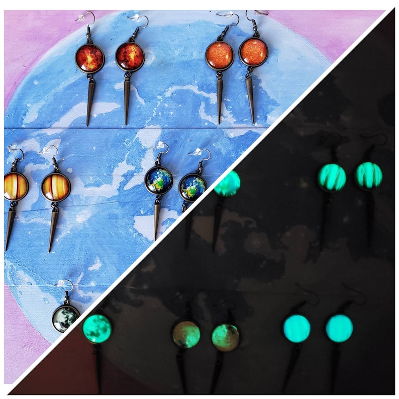 May include: A set of 10 pairs of earrings featuring glow-in-the-dark and non-glow-in-the-dark planets and galaxy designs. The earrings are silver with a black dangle and a round glass cabochon.