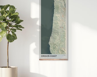 May include: A vertical map print of the Oregon Coast with a wooden frame. The map is a topographic map with green and blue colors. The text "OREGON COAST" is printed at the bottom of the map.