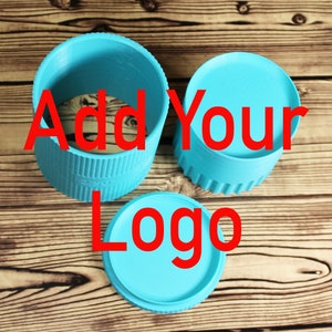 May include: Three turquoise blue cylindrical containers with the text "Add Your Logo" in red letters. The containers are on a wooden surface.