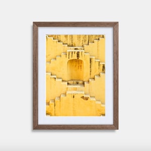 May include: A framed photograph of a yellow building with a series of steps leading up to a doorway. The frame is ash grey.