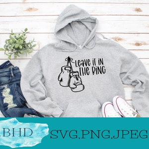 May include: Gray hooded sweatshirt with the text "Leave it in the ring" and a graphic of boxing gloves.