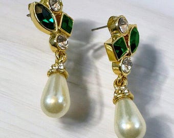 May include: Gold tone drop earrings with green and clear rhinestones and a faux pearl drop.