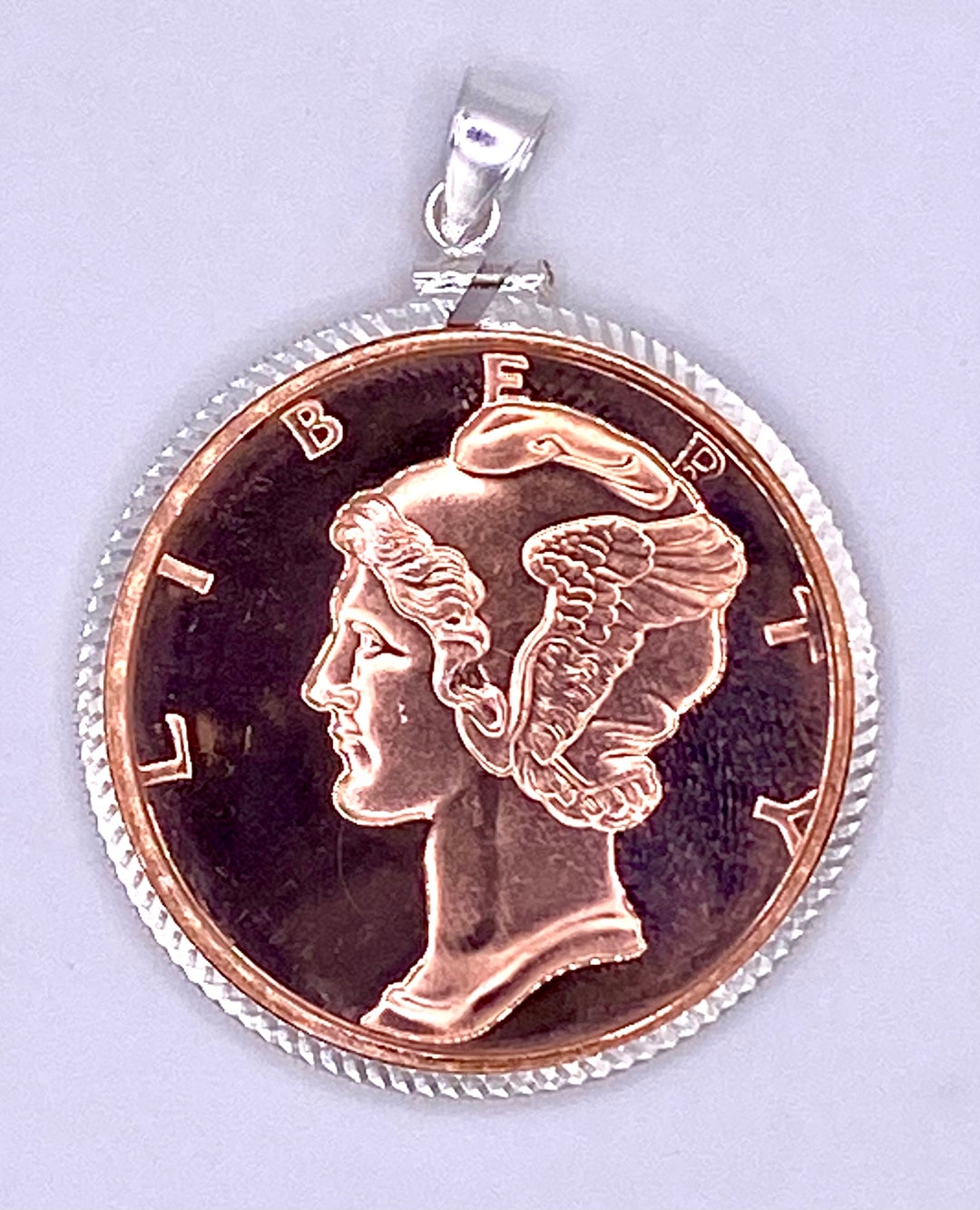 1 Troy Oz of .999 Pure Copper Mercury Round With a Sterling Silver