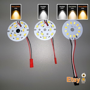 May include: Three round LED light panels with 12 LEDs each. The panels are wired with red, black, and white wires. The panels are labeled "Ledesk" and "SOMM-TOLET".