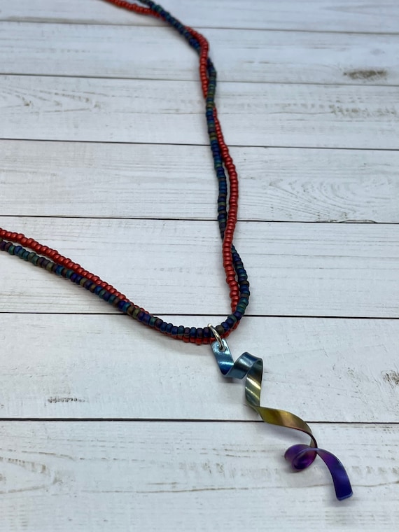 Beaded Necklace With Metal Ribbon Like Pendant - Double Strand 