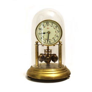 Lovely well working 400 day mechanical miniature Kern clock (made by Kern & Sohne in Germany) in glass dome 1950s