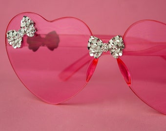 Hearts and bows sunglasses in Barbie pink, Blue or clear.