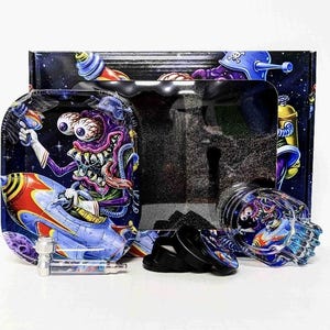 May include: A set of smoking accessories featuring a cartoon alien in a spaceship design. The set includes a rolling tray, grinder, glass pipe, and a storage container, all with a space-themed illustration.