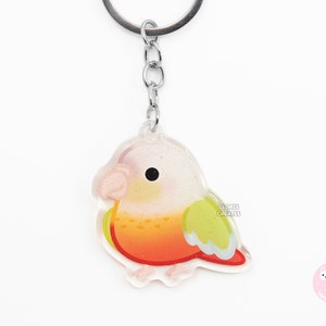 Llavero acrílico de pájaro conure de mejillas verdes con forma de piña, estilo kawaii de dibujos animados con purpurina, regalo para amantes de las mascotas exóticas chibi.