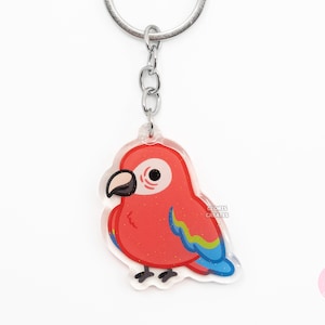 Llavero acrílico de guacamayo de alas verdes, diseño de pájaro, con purpurina de doble cara y arte kawaii, ideal como regalo para amantes de las mascotas exóticas.