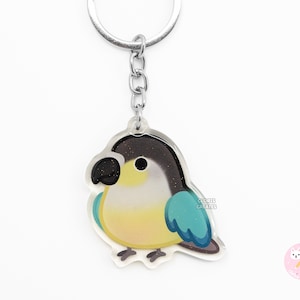 Llavero acrílico de pájaro conure de mejillas verdes, turquesa y amarillo, con purpurina de arte kawaii de dibujos animados, regalo para amantes de las mascotas chibi.