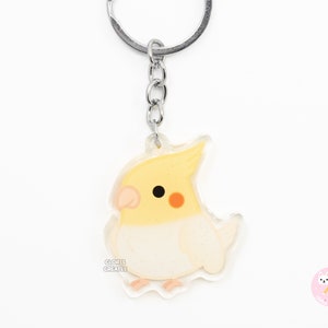Llavero acrílico de loro y cacatúa Lutino / Dije de purpurina de doble cara con diseño de dibujos animados kawaii / Regalo para amantes de las mascotas exóticas