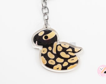 Llavero de serpiente acrílica de pitón bola en tonos pastel negro/dije de purpurina de mascota exótica con diseño de dibujos animados kawaii/reptil chibi lindo/regalo para amantes de los animales