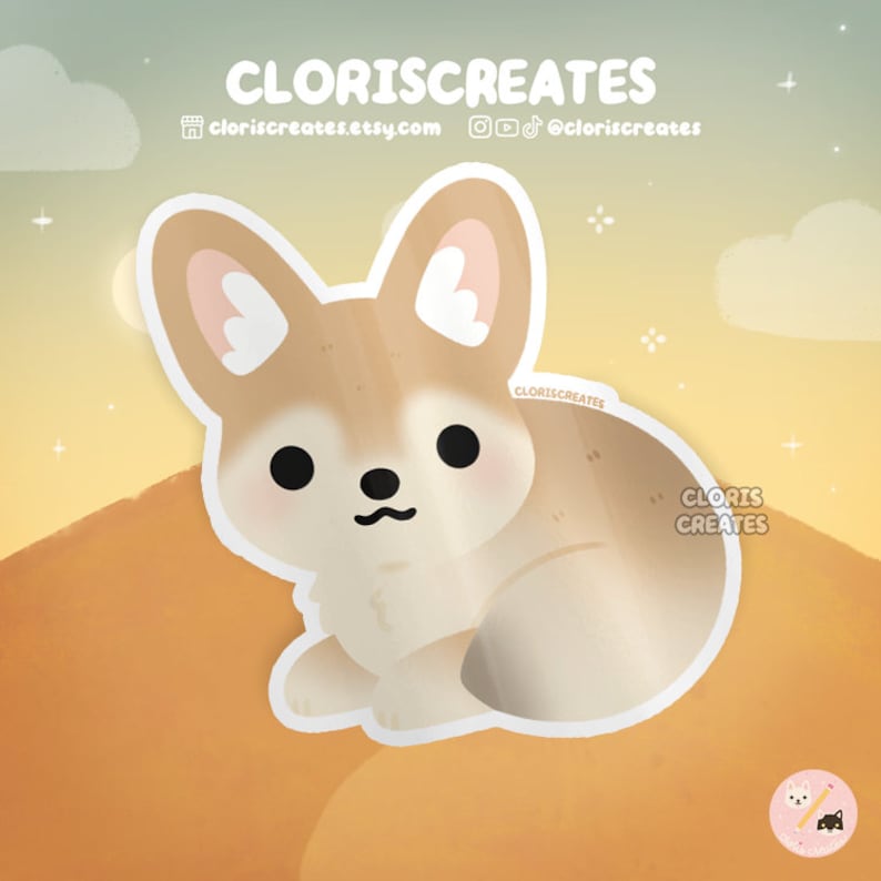May include: A sticker featuring a cartoon fennec fox with large ears, brown fur, and a white belly. The fox is sitting on a sand dune with a sunset in the background.