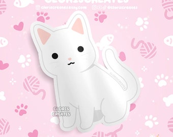 May include: White cat sticker with a pink background. The cat is sitting with its tail curled around its body. The background is covered in hearts, paw prints, and yarn balls.
