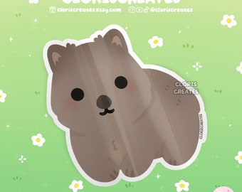 Puede incluir: Una linda ilustración de dibujos animados de un quokka marrón y blanco, un pequeño marsupial nativo de la isla Rottnest, Australia. El quokka está sentado sobre un fondo verde con flores blancas.