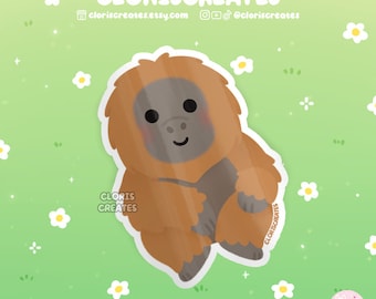 Puede incluir: Una pegatina con un orangután de dibujos animados con pelaje marrón y naranja, sonriendo con los brazos cruzados. La pegatina está sobre un fondo verde con flores blancas.