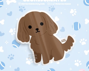 May include: A brown cartoon dog with floppy ears sitting on a light blue background with white paw prints and blue tennis balls. The dog has a brown nose and black eyes. The text "CLORIS CREATES" is in the top center of the image.