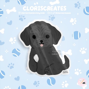 May include: A black cartoon dog sticker with a light blue background featuring paw prints, bones, and tennis balls. The sticker has the text "CLORISCREATES" and the website address "cloriscreatesetsy.com".