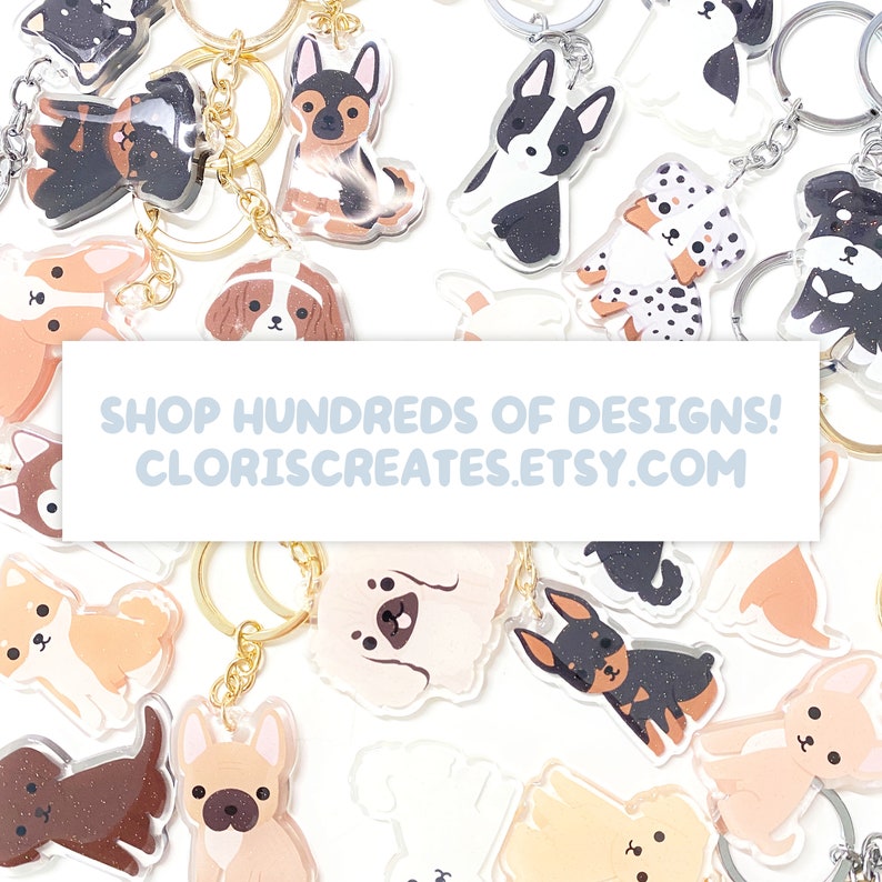May include: A collection of colorful, cartoon animal keychains with glitter accents. The keychains feature various dog breeds, including a French Bulldog, a Poodle, a Dachshund, and a Chihuahua. The keychains are displayed on a white background with the text "SHOP HUNDREDS OF DESIGNS! CLORISCREATES.ETSY.COM".