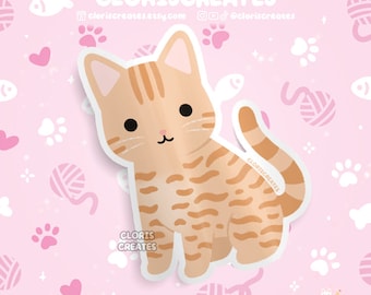 May include: A cute cartoon illustration of an orange tabby cat with brown stripes. The cat is sitting with its tail curled around its body. The background is pink with white paw prints, hearts, and yarn balls.