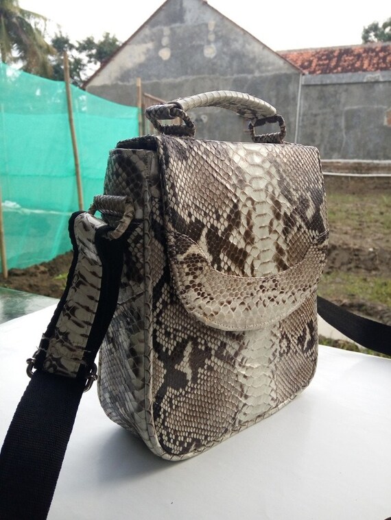 Snake print sling bag sale