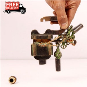 May include: Antique brass lock with an intricate design, featuring a keyhole, a chain, and a small metal ball. The lock is open and the keyhole is visible.