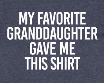May include: A dark blue t-shirt with white text that reads "My favorite granddaughter gave me this shirt."